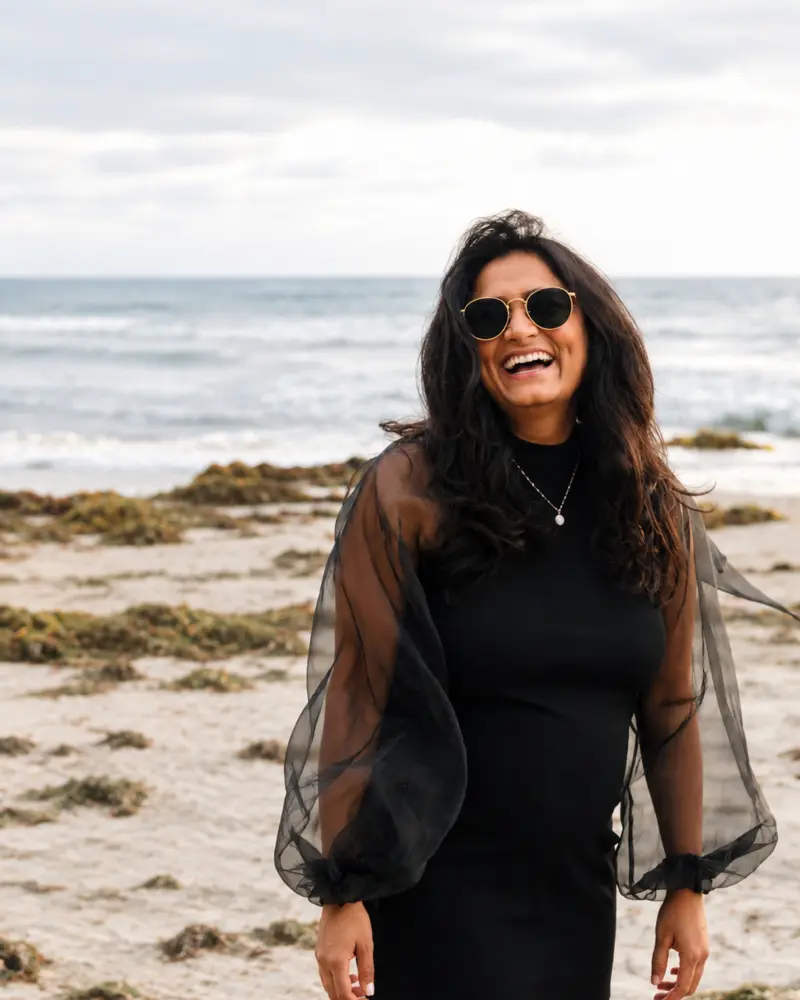 Maitri smiling by the ocean